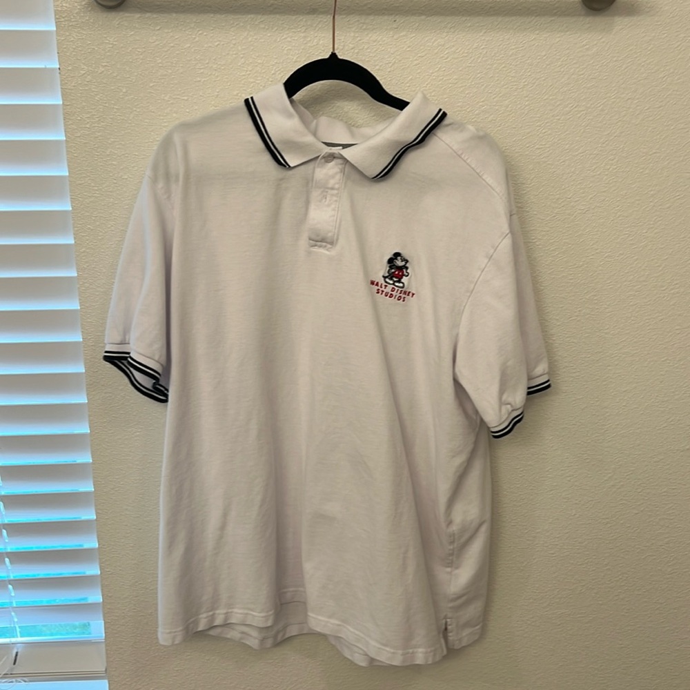 Walt Disney Studios Golf Shirt White with black accents on sleeves and collar.